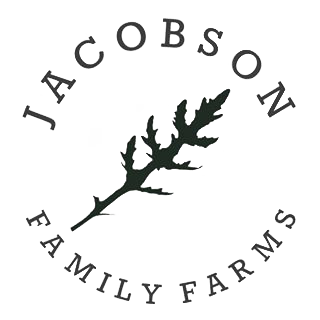 Jacobson Family Farms Illinois - Farm Logo Logo of Jacobson Family Farms, featuring a stylized leaf design with the text "Jacobson" above and "Family Farms" below, emphasizing the farm's focus on family-owned agricultural practices.